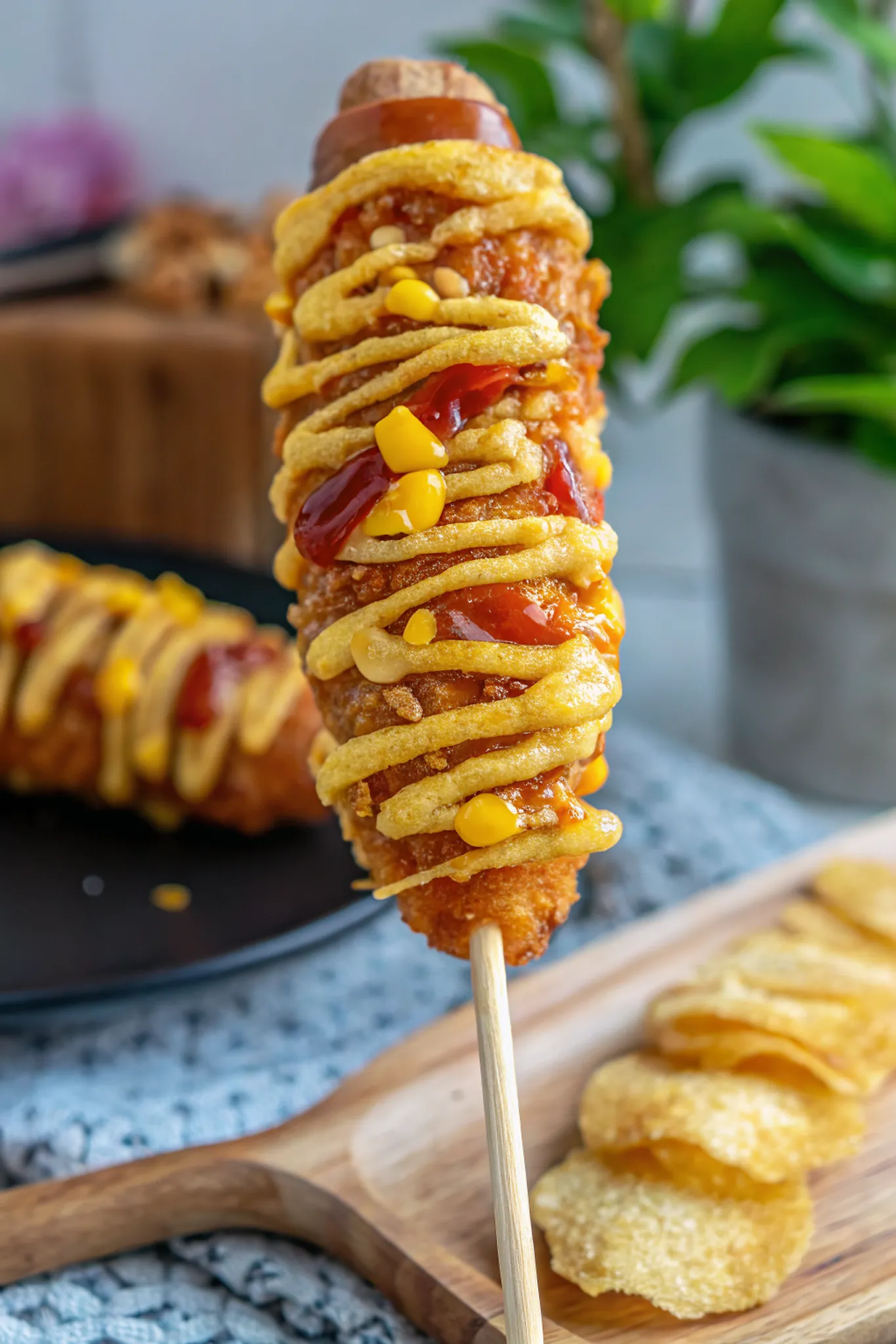 Perfectly seared Korean Corn Dog (Gamja Hotdog) served professional style