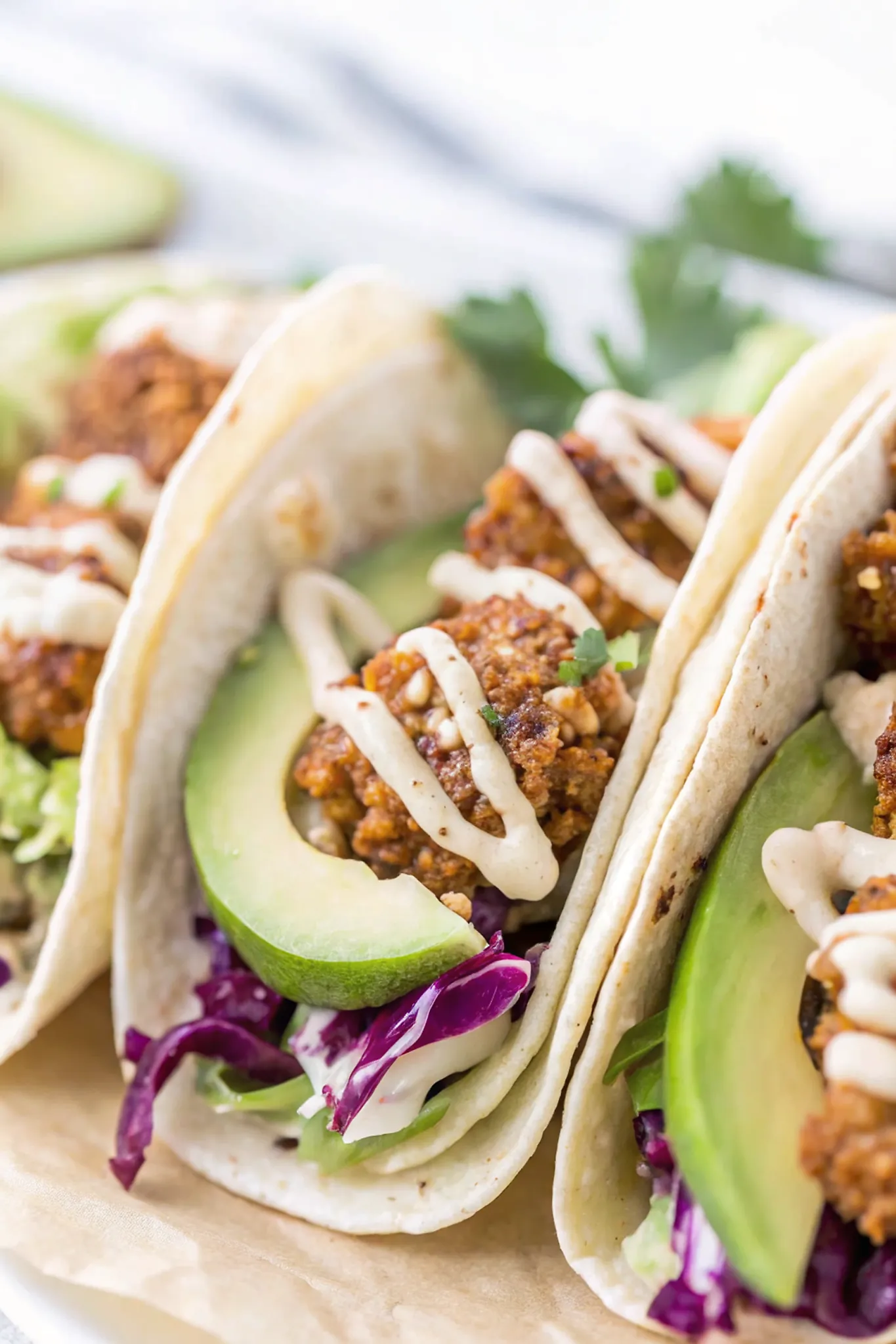 Perfectly seared Crispy Tofu Tacos with Vegan Lime Crema served professional style