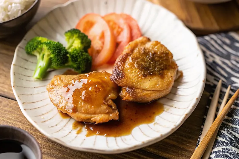 Perfectly seared Butter Shoyu Chicken served professional style