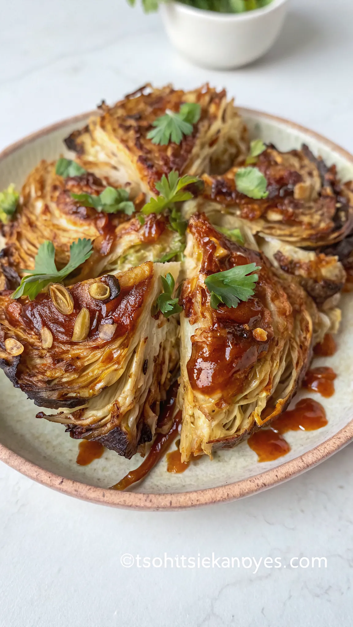 Charred Cabbage with Gochujang Butter Sauce and Caramelised Onions 4 Perfectly seared Charred Cabbage with Gochujang Butter Sauce and Caramelised Onions served professional style