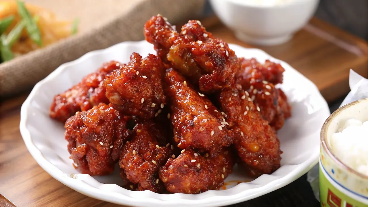 Perfectly seared Sweet, sour, & spicy Korean fried chicken (Yangnyeom-tongdak) served professional style