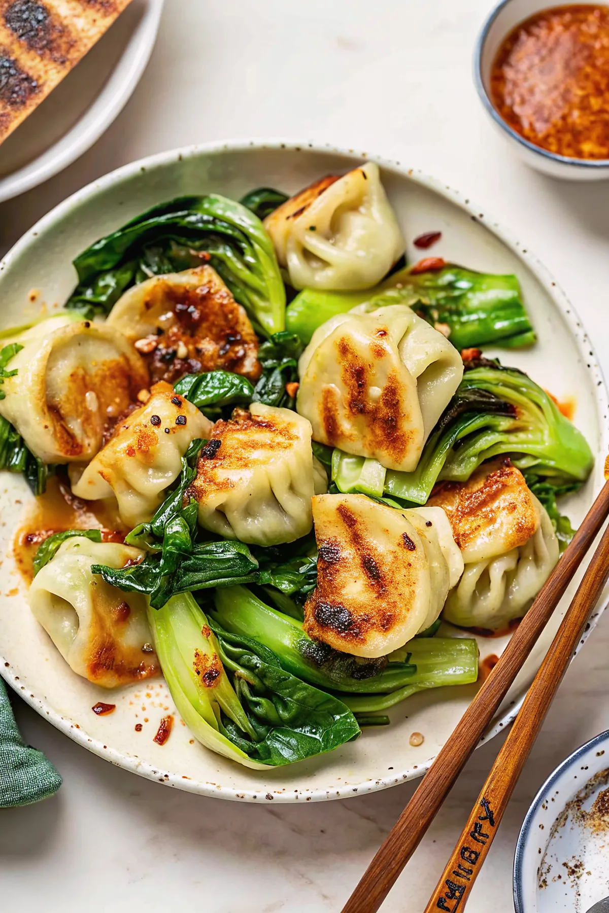 Perfectly seared 15-Minute Pan-Fried Dumplings with Bok Choy served professional style