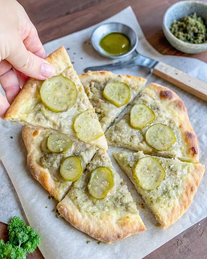 Perfectly seared Vegan Dill Pickle Pizza served professional style